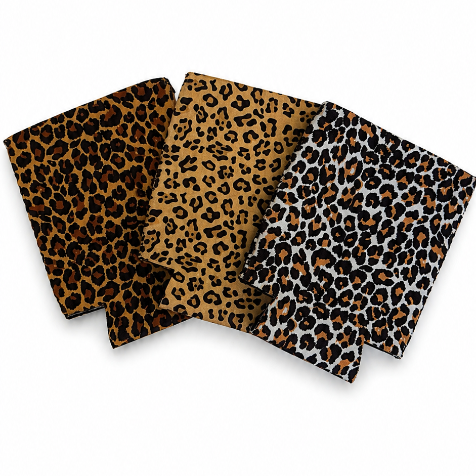 Four leopard print fabric swatches arranged in a row on a white background