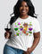 A woman holding a glass of wine and wearing a white round-neck t-shirt with a graphic of wine glasses and crawfish, indicating a wine-themed design.