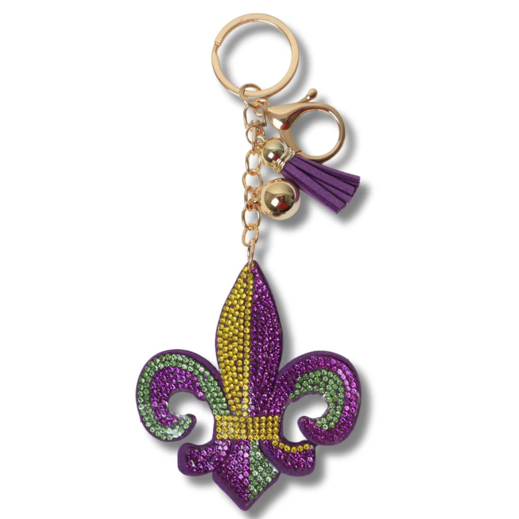 A Mardi Gras Fleur De Lis keychain with purple, green, and gold colors and a tassel.